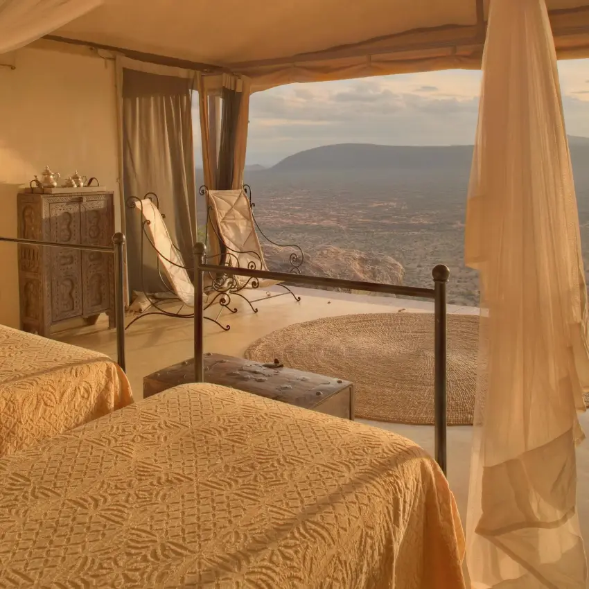 Bedroom with four-poster bed overlooking savanna landscape, Saruni Samburu, Samburu Reserve, Kenya