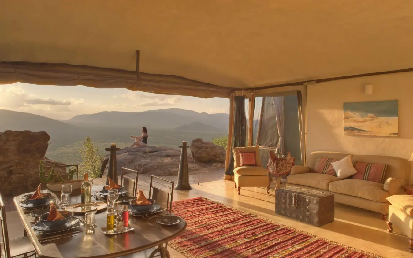 Interior lounge with expansive windows overlooking mountain landscape, Saruni Samburu, Samburu Reserve, Kenya