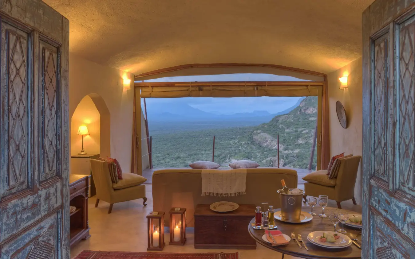 Interior lounge with expansive windows overlooking valley landscape, Saruni Samburu, Samburu Reserve, Kenya