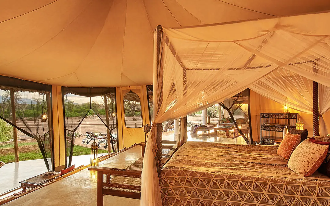 Luxury tent bedroom with four-poster bed and canvas walls, Sasaab, Samburu Reserve, Kenya