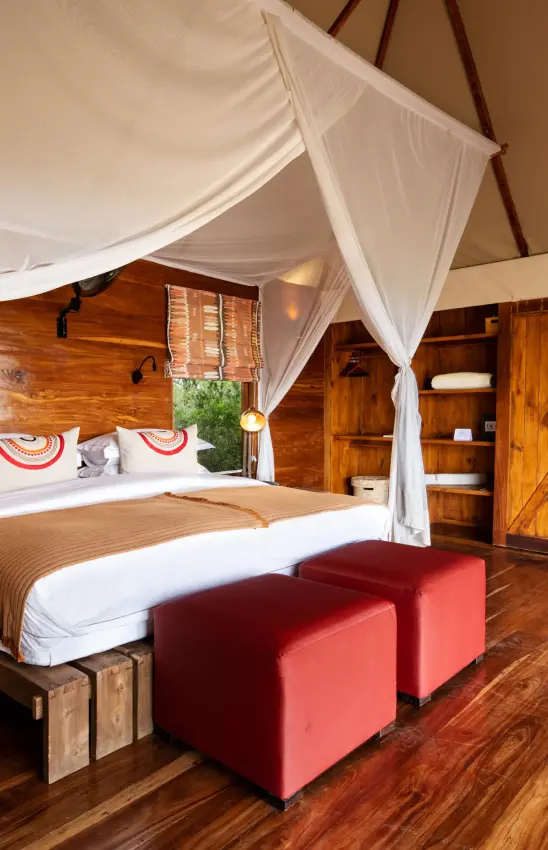 Spacious bedroom with canopy bed and en-suite bathroom, Sayari Camp, Serengeti National Park, Tanzania
