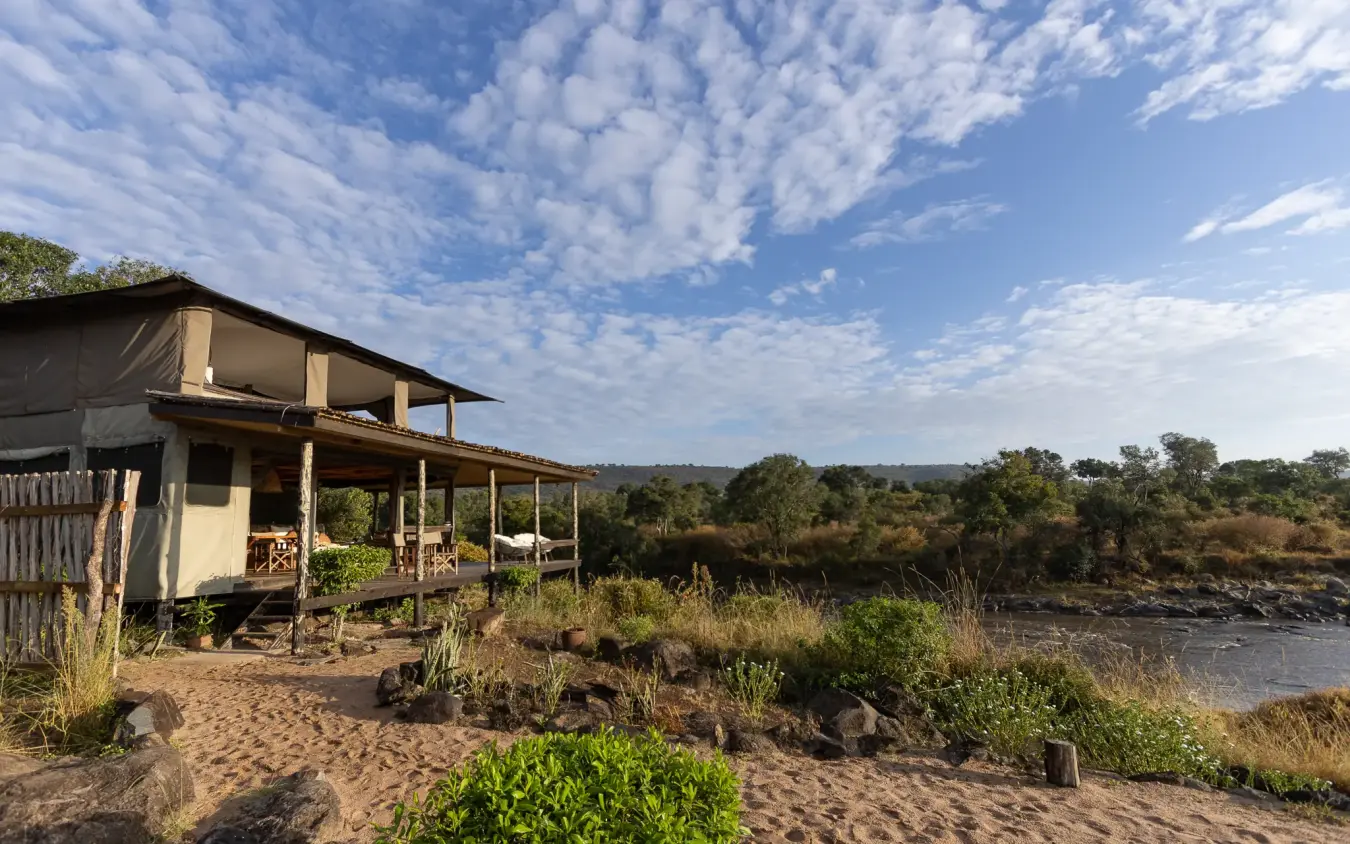 Riverside lodge with canvas tent and sandy beach