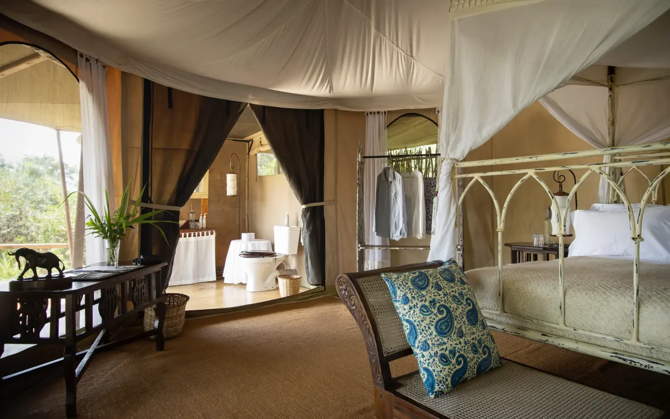 Luxury safari tent bedroom with four-poster bed and draped canopy, Serian “The Original”, Maasai Mara, Kenya