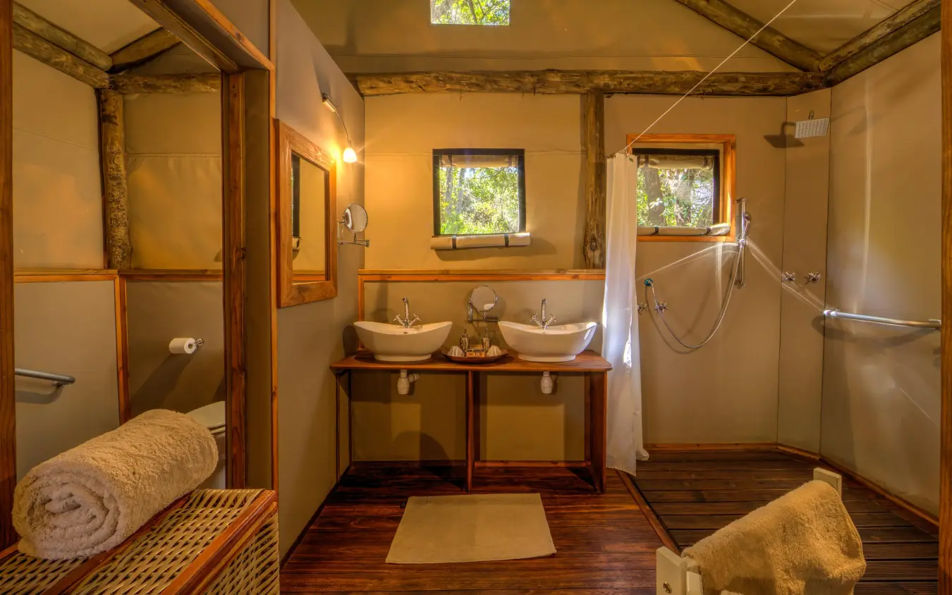 Spacious bathroom with dual vessel sinks and separate shower areas, Setari, The Okavango Delta, Botswana
