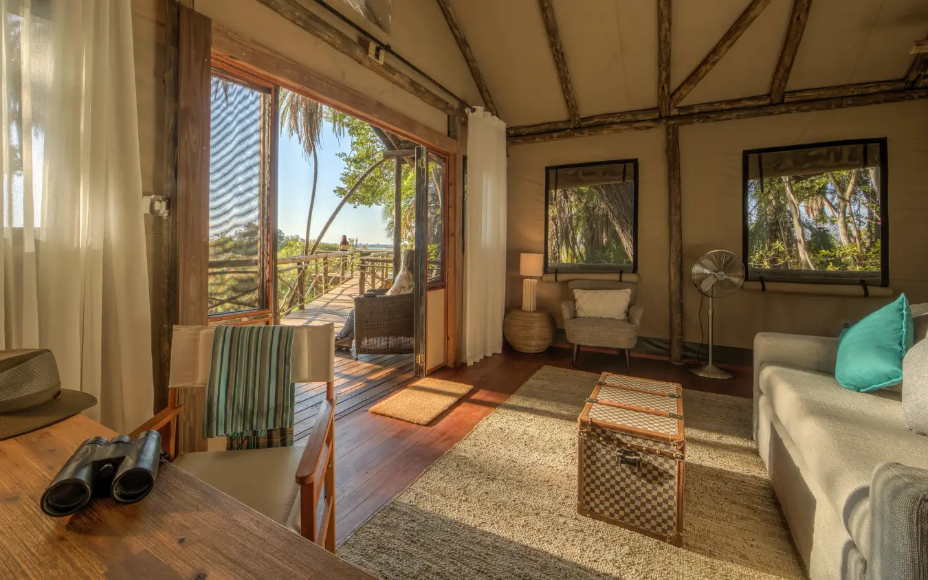 Luxury safari tent interior with deck views and natural light, Setari, The Okavango Delta, Botswana
