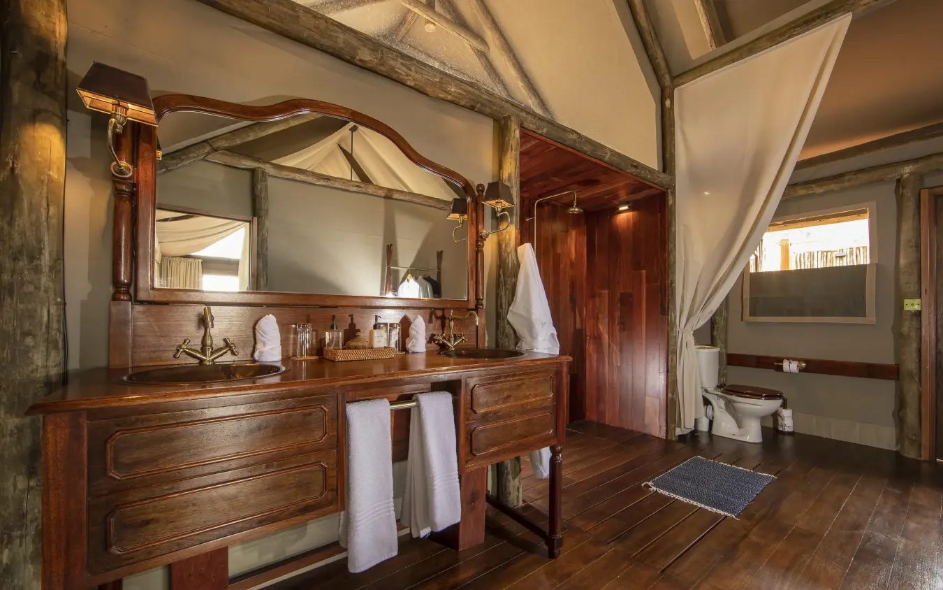 Wooden vanity with mirror in safari lodge bathroom, Shinde, The Okavango Delta, Botswana