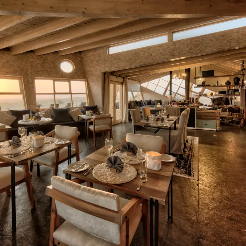 Open-plan interior with ocean views and dining areas, Shipwreck Lodge, Skeleton Coast, Namibia