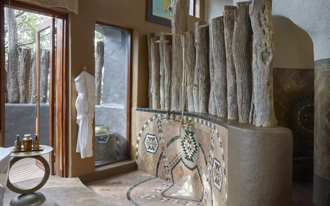 Luxurious bathroom with rustic wood accents and natural light, Singita Pamushana, Gonarezhou & Malilangwe, Zimbabwe