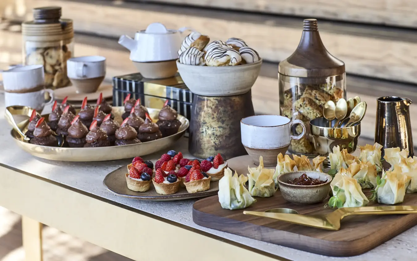 Outdoor table display of gourmet appetizers and desserts, Singita Pamushana, Gonarezhou & Malilangwe, Zimbabwe
