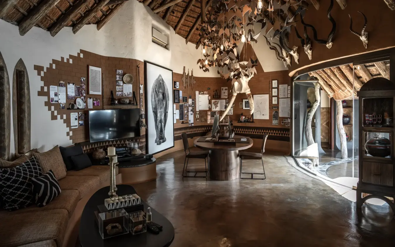 Open-plan lodge lounge with high ceiling and traditional decor, Singita Pamushana, Gonarezhou & Malilangwe, Zimbabwe