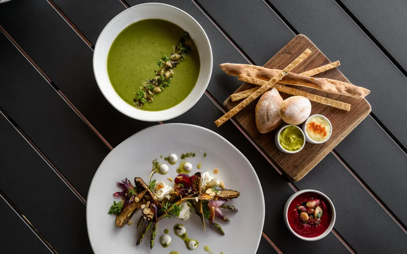 Plated okra dish with soup and bread service, Singita Sasakwa Lodge, Serengeti National Park, Tanzania