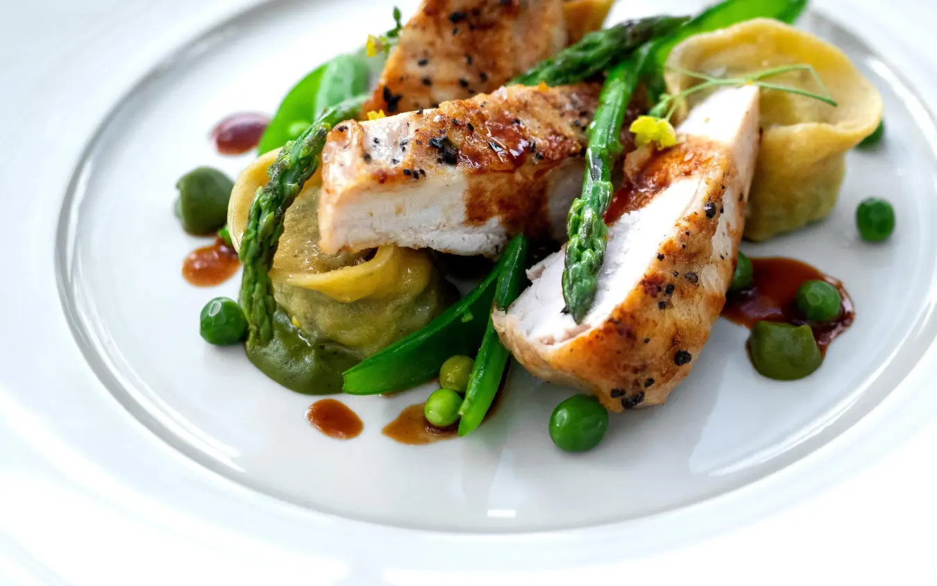 Plated chicken breast with asparagus and peas, Singita Sasakwa Lodge, Serengeti National Park, Tanzania