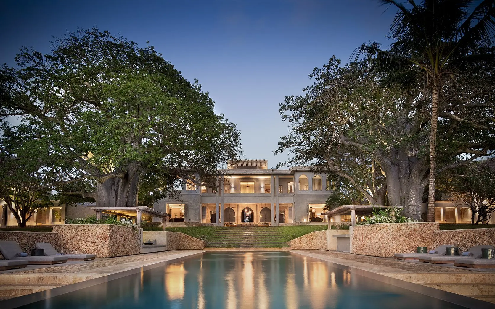 Rectangular reflecting pool with colonial mansion and mature trees, Sirai Beach, Kilifi, Kenya