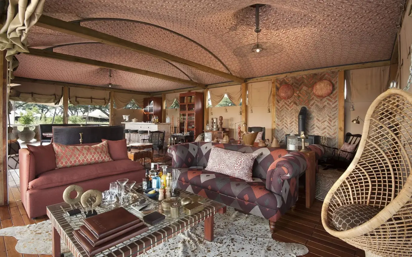 Safari lodge lounge with burgundy seating and textured ceiling, Somalisa Camp, Hwange National Park, Zimbabwe