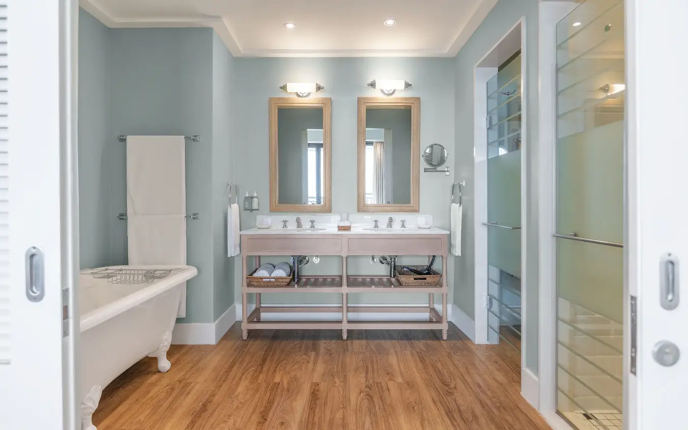 Luxury bathroom with dual vanity and freestanding soaking tub, Strand Hotel Swakopmund, Swakopmund, Namibia