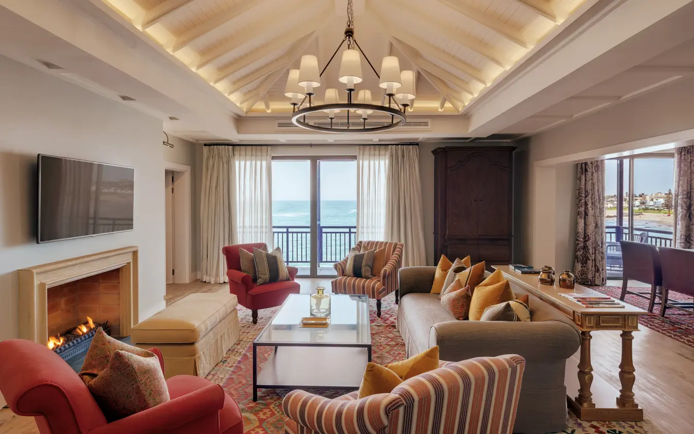 Luxury coastal suite with ocean views and fireplace seating area, Strand Hotel Swakopmund, Swakopmund, Namibia