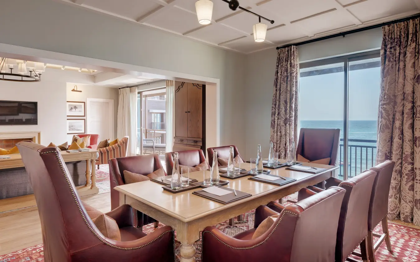 Oceanfront dining room with conference table and coastal views, Strand Hotel Swakopmund, Swakopmund, Namibia