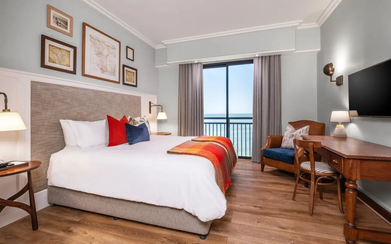 Hotel bedroom with balcony overlooking coastal water view, Strand Hotel Swakopmund, Swakopmund, Namibia
