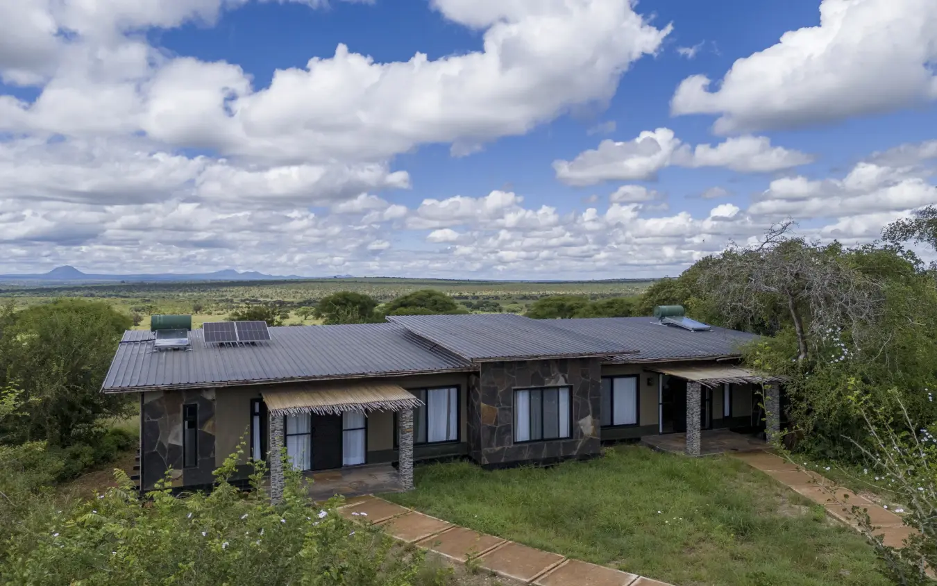 Modern lodge with solar panels overlooking vast savanna landscape, Tarangire Elephant Springs, Tarangire National Park, Tanzania