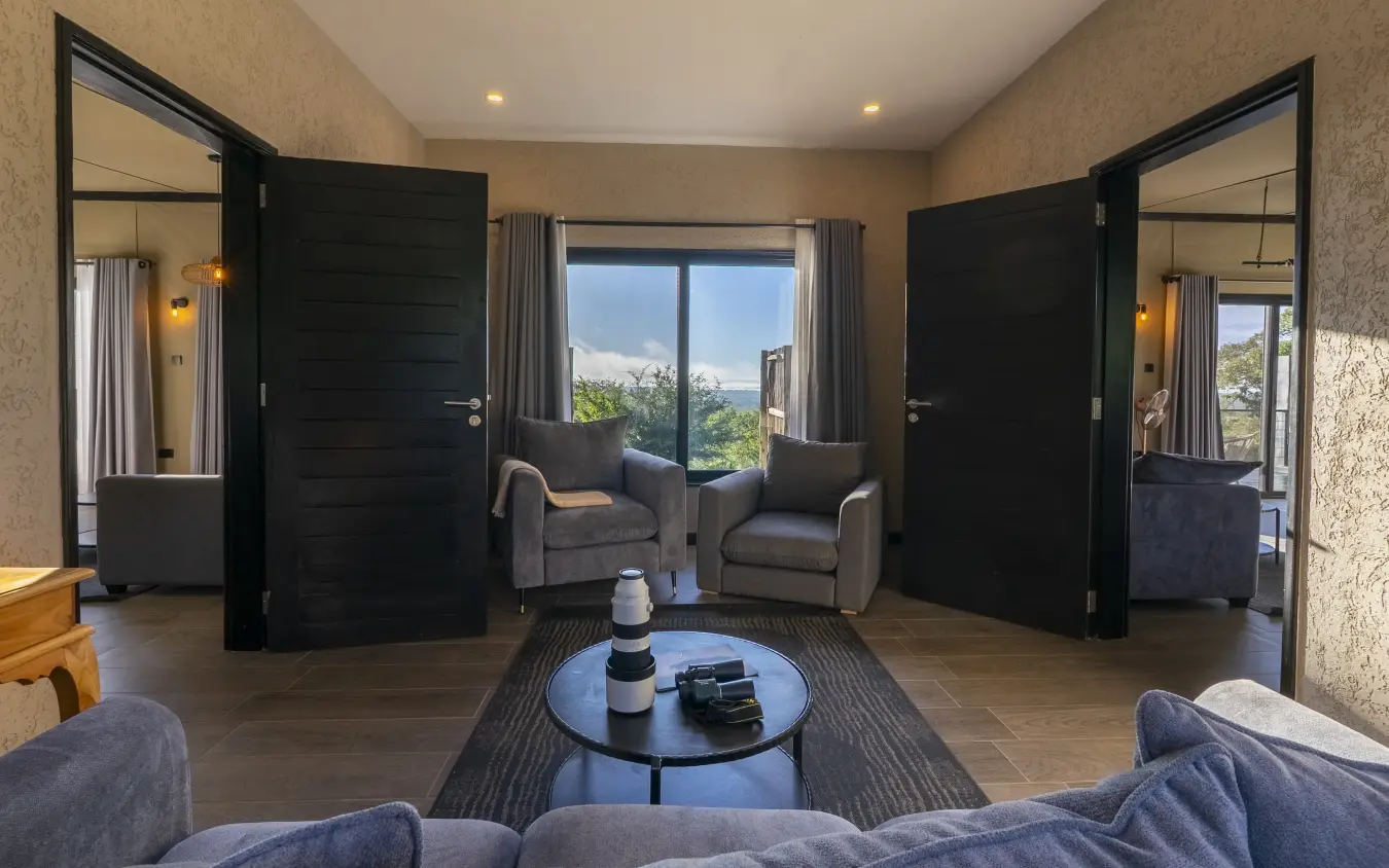 Luxury suite interior with panoramic windows overlooking landscape and mountains, Tarangire Elephant Springs, Tarangire National Park, Tanzania