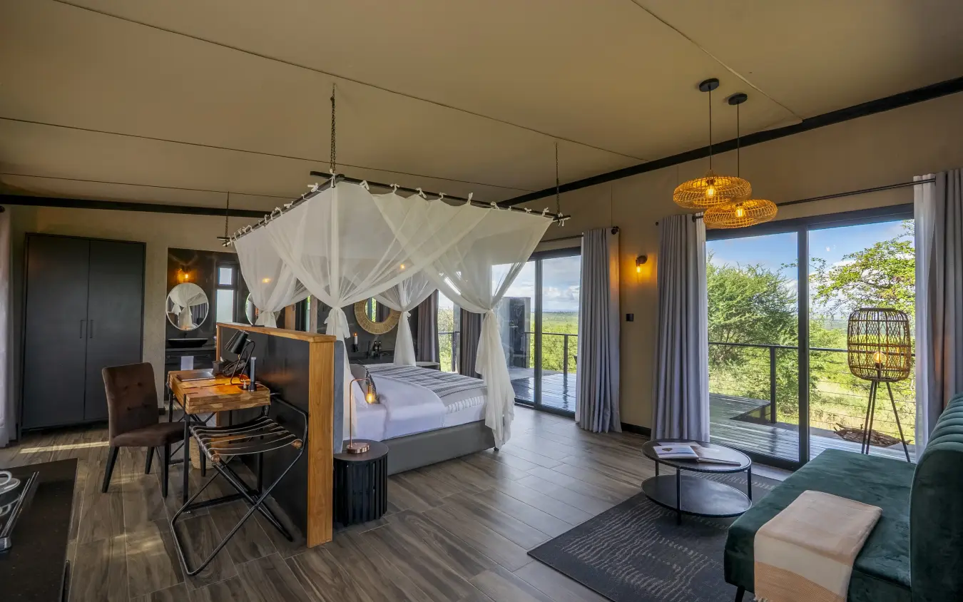 Luxury bedroom suite with canopy bed and panoramic savanna views, Tarangire Elephant Springs, Tarangire National Park, Tanzania