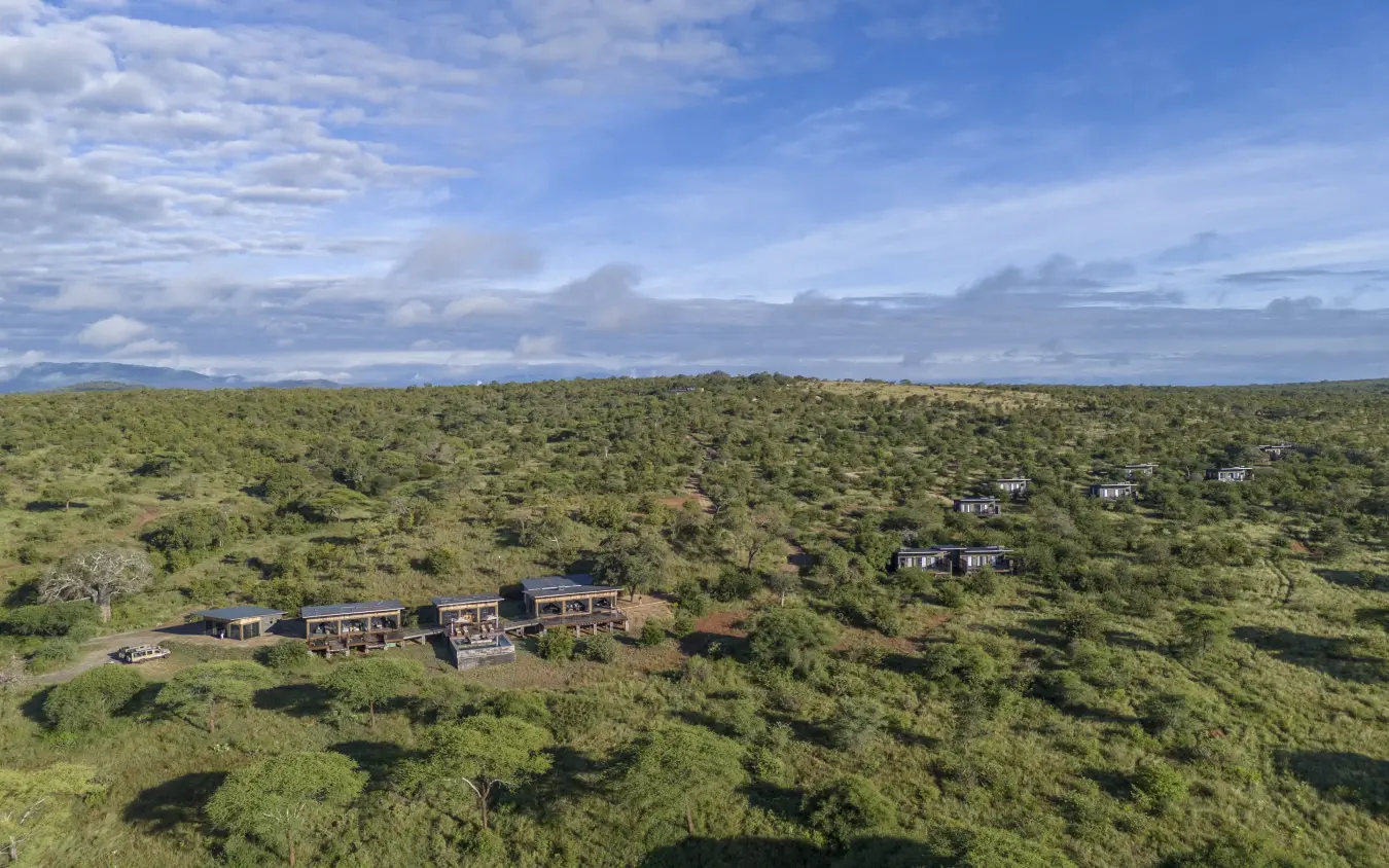 Aerial view of luxury lodge compounds scattered across bushland savanna, Tarangire Elephant Springs, Tarangire National Park, Tanzania