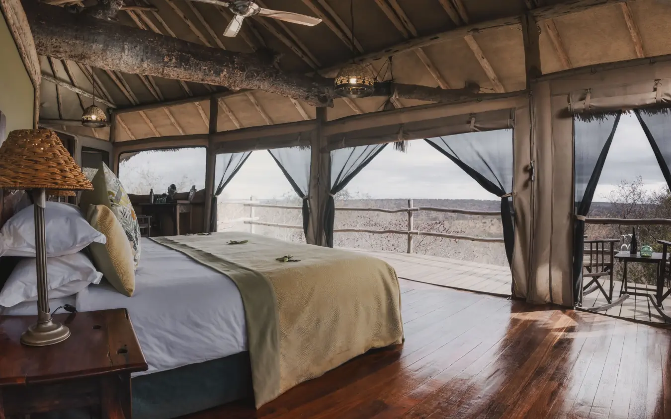 Luxury safari bedroom with open views across vast grassland plains, Tarangire Treetops, Tarangire National Park, Tanzania