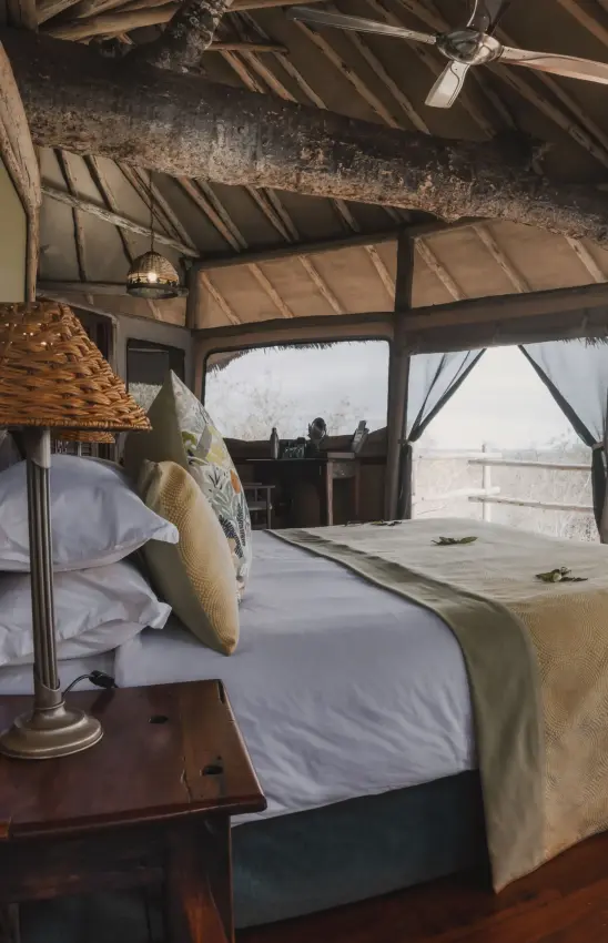 Luxury safari bedroom with open-air views of expansive landscape, Tarangire Treetops, Tarangire National Park, Tanzania