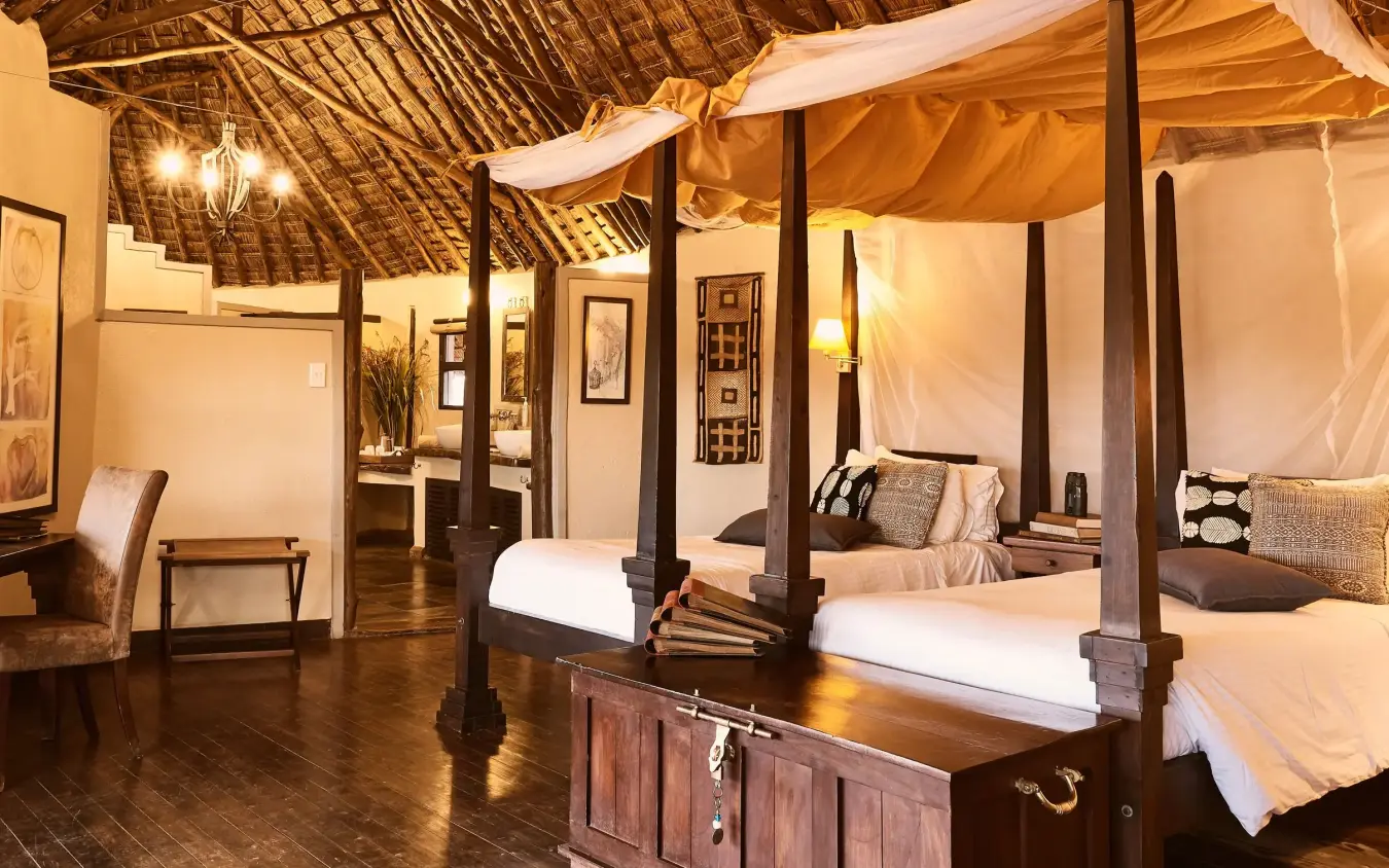 Spacious bedroom with four-poster bed and draped canopy, Tawi Lodge, Amboseli and Chyulu Hills, Kenya