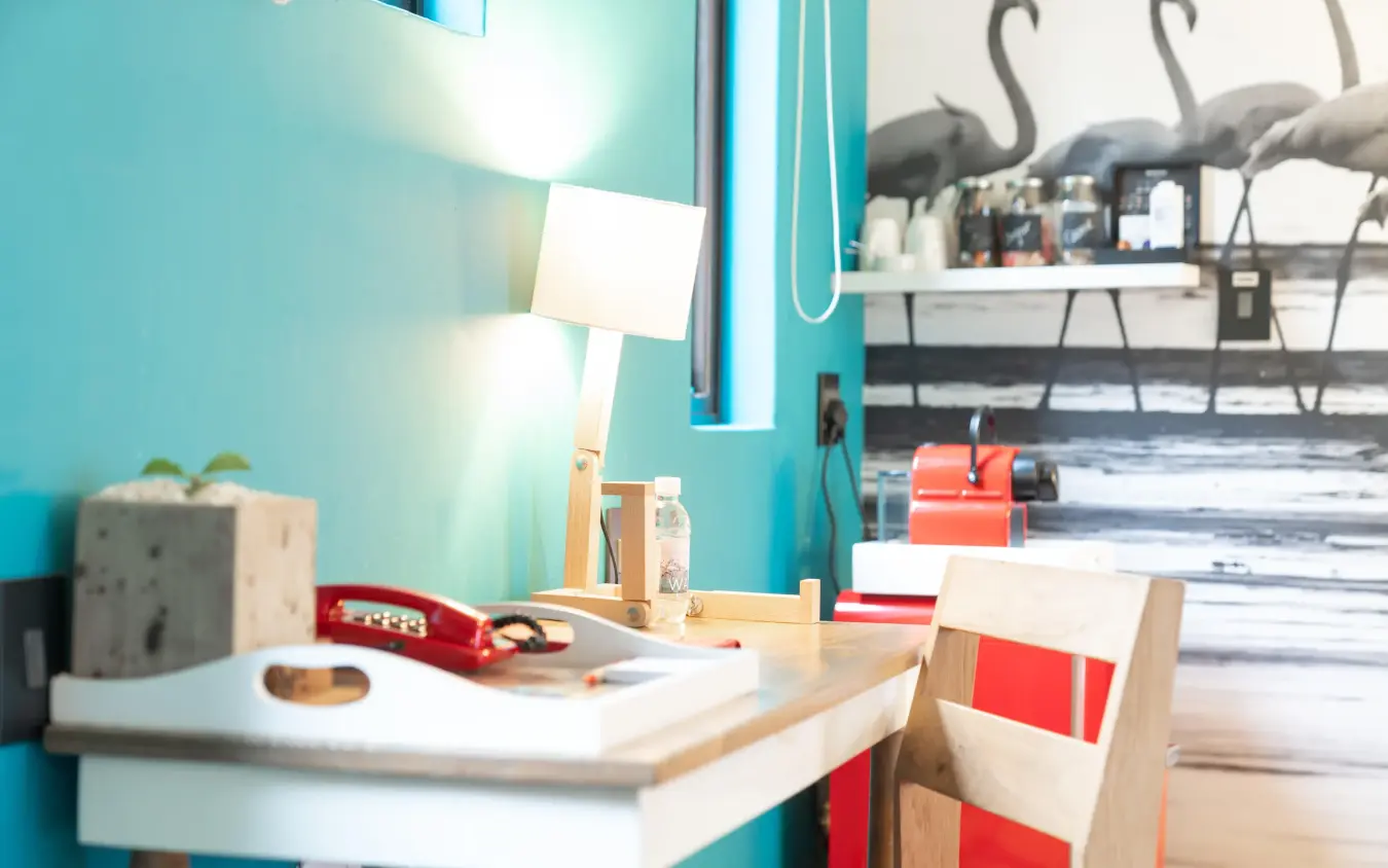 Modern workspace with turquoise wall and natural lighting, The Delight Swakopmund, Swakopmund, Namibia