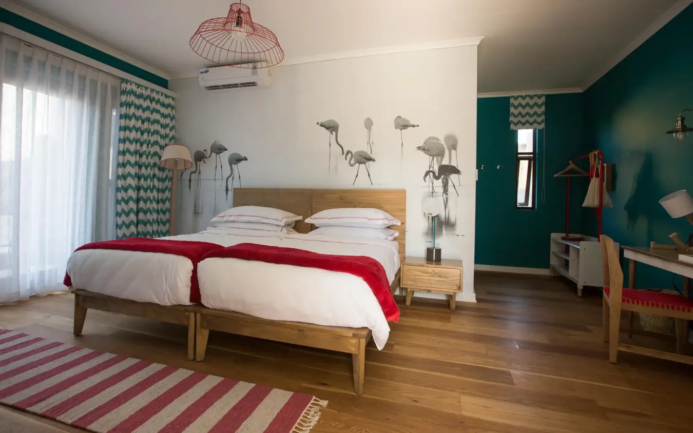 Contemporary bedroom with wooden bed and teal accent walls, The Delight Swakopmund, Swakopmund, Namibia