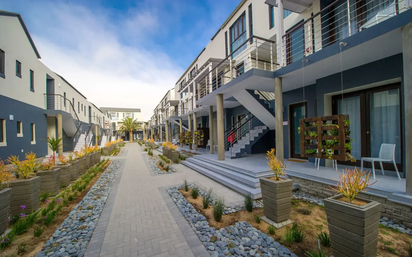 Modern residential courtyard with paved pathways and contemporary architecture, The Delight Swakopmund, Swakopmund, Namibia