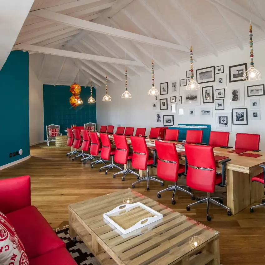Modern meeting room with red chairs and exposed beam ceiling, The Delight Swakopmund, Swakopmund, Namibia