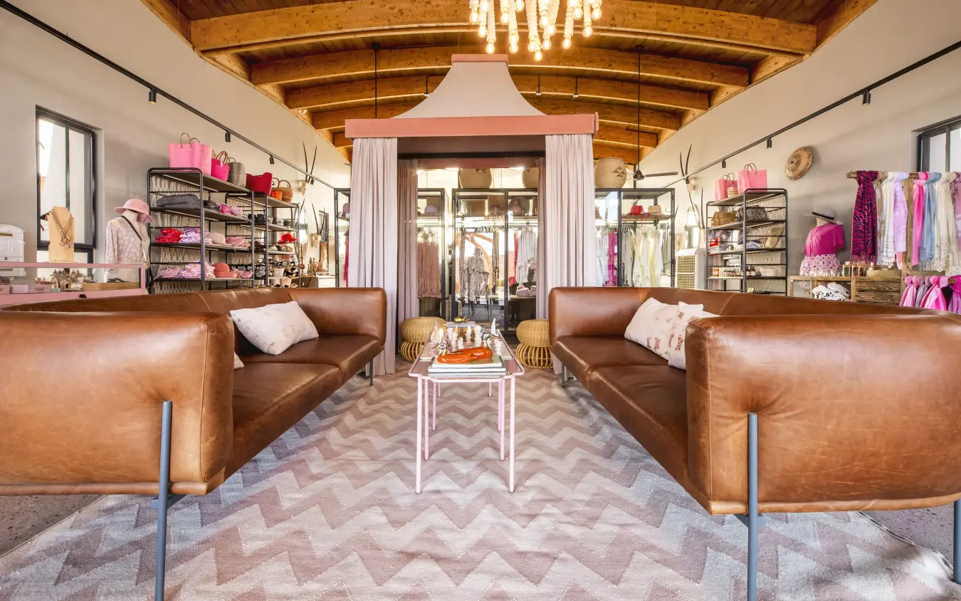 Luxury boutique fashion retail interior with leather seating and wooden beamed ceiling, The Desert Grace, Sossusvlei, Namibia