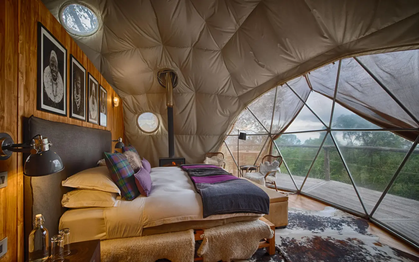Geodesic dome bedroom with expansive windows overlooking countryside, The Highlands, Ngorongoro Crater, Tanzania
