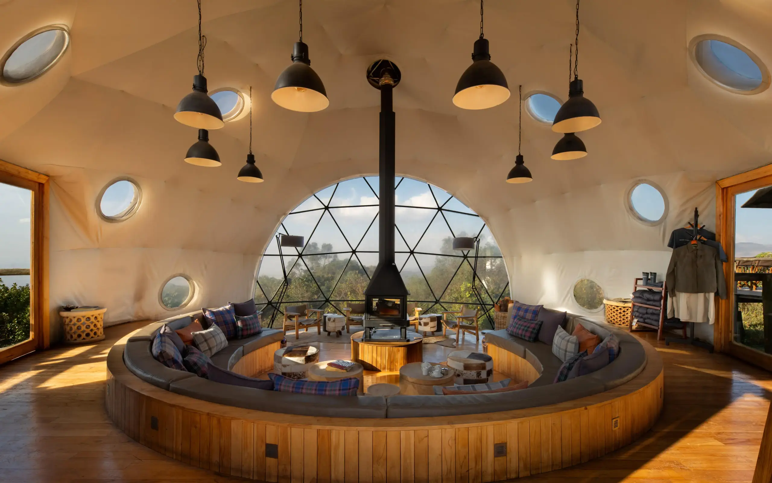 Circular lounge with central fireplace and geodesic dome ceiling, The Highlands, Ngorongoro Crater, Tanzania