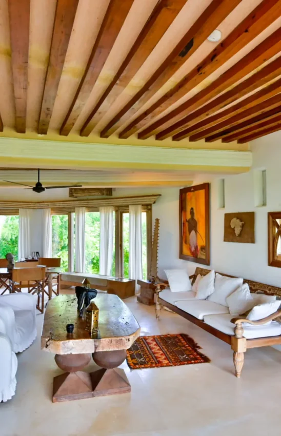 Spacious open-plan lounge with wooden ceiling and furnishings, The Majlis Resort, Lamu Archipelago, Kenya