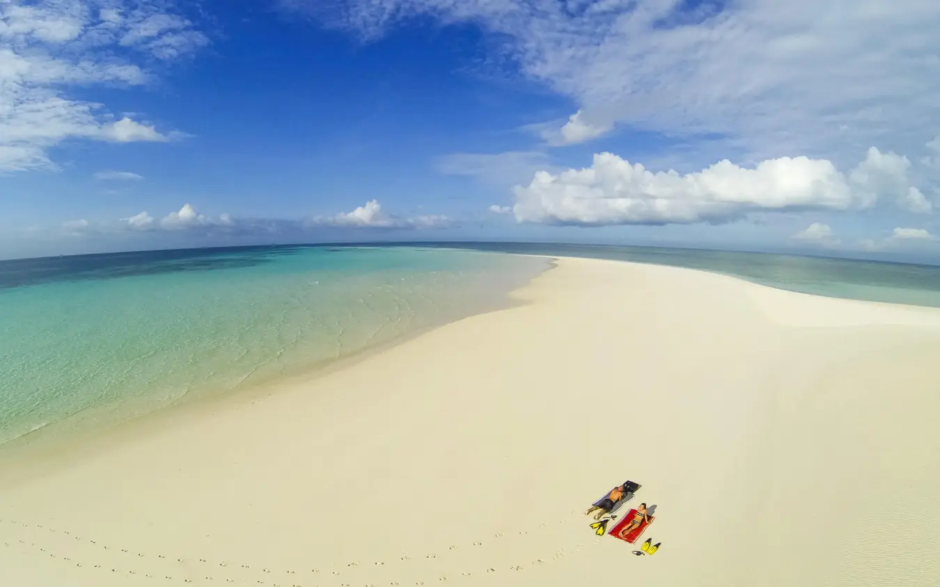 Kayak beached on pristine white sand tropical island, The Manta Resort, Zanzibar & Pemba, Tanzania