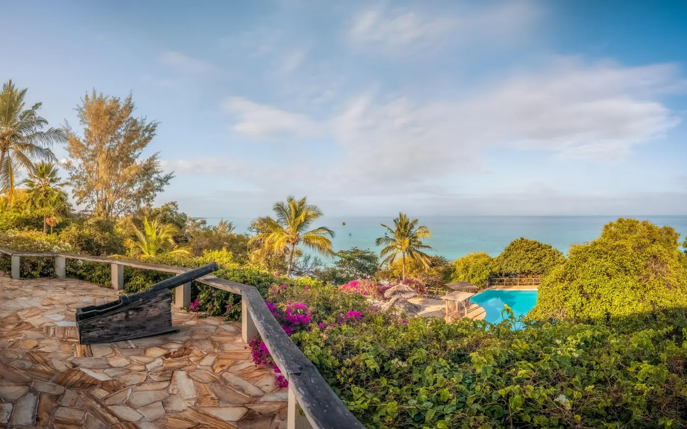 Stone terrace overlooking tropical beach with turquoise waters, The Manta Resort, Zanzibar & Pemba, Tanzania