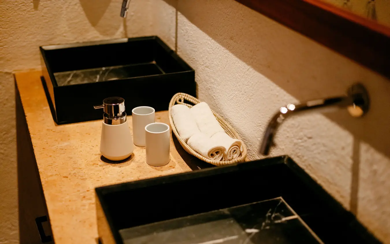 Bathroom vanity with soap dispenser and rolled towels, Villa Kigali, Kigali, Rwanda