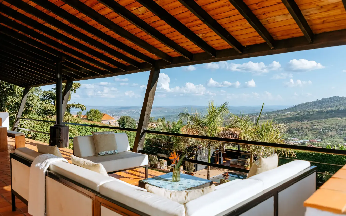 Covered terrace with seating overlooking valley landscape, Villa Kigali, Kigali, Rwanda