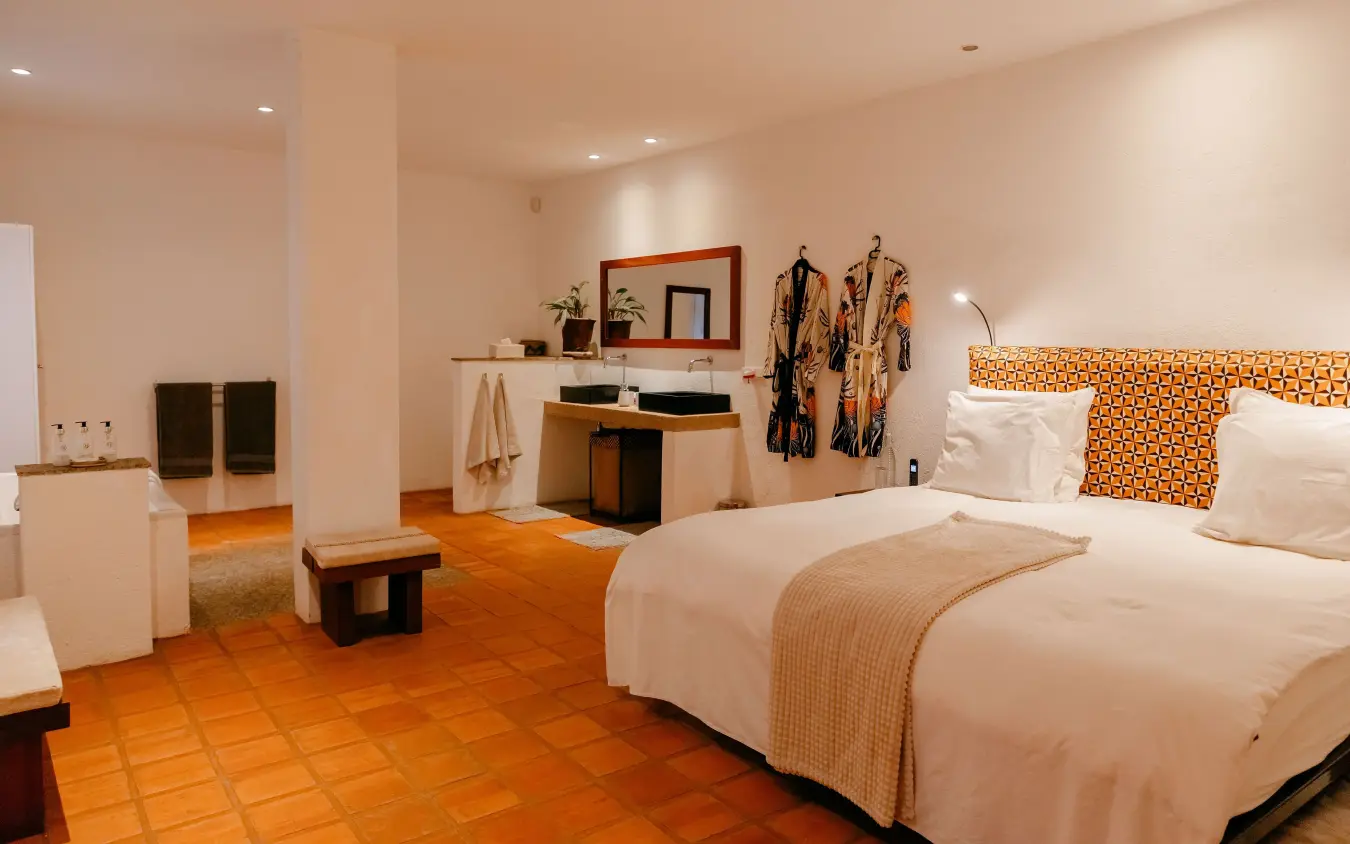 Spacious bedroom with twin beds and terracotta tile flooring, Villa Kigali, Kigali, Rwanda