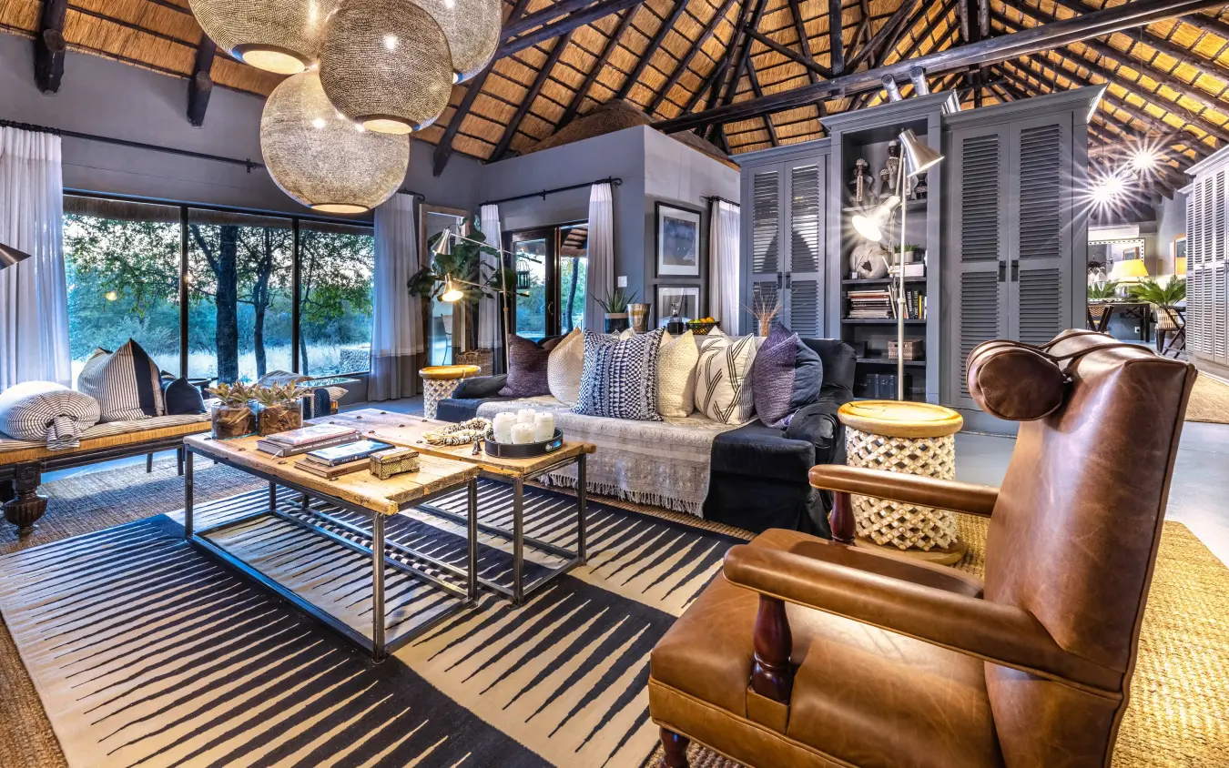 Modern safari lodge interior with waterfront views and contemporary furnishings, Villa Mushara, Etosha National Park, Namibia