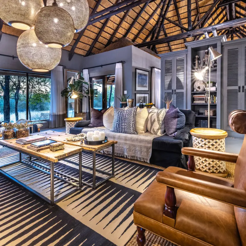 Modern safari lodge interior with waterfront views and contemporary furnishings, Villa Mushara, Etosha National Park, Namibia