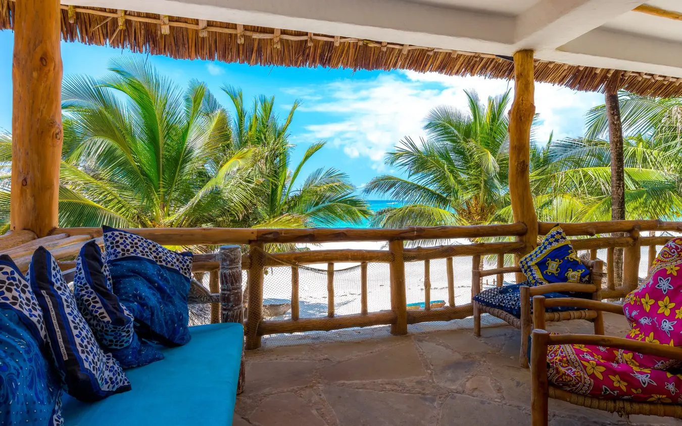 Beachfront deck with palm trees and ocean view, Waterlovers Beach Resort, Diani Beach, Kenya