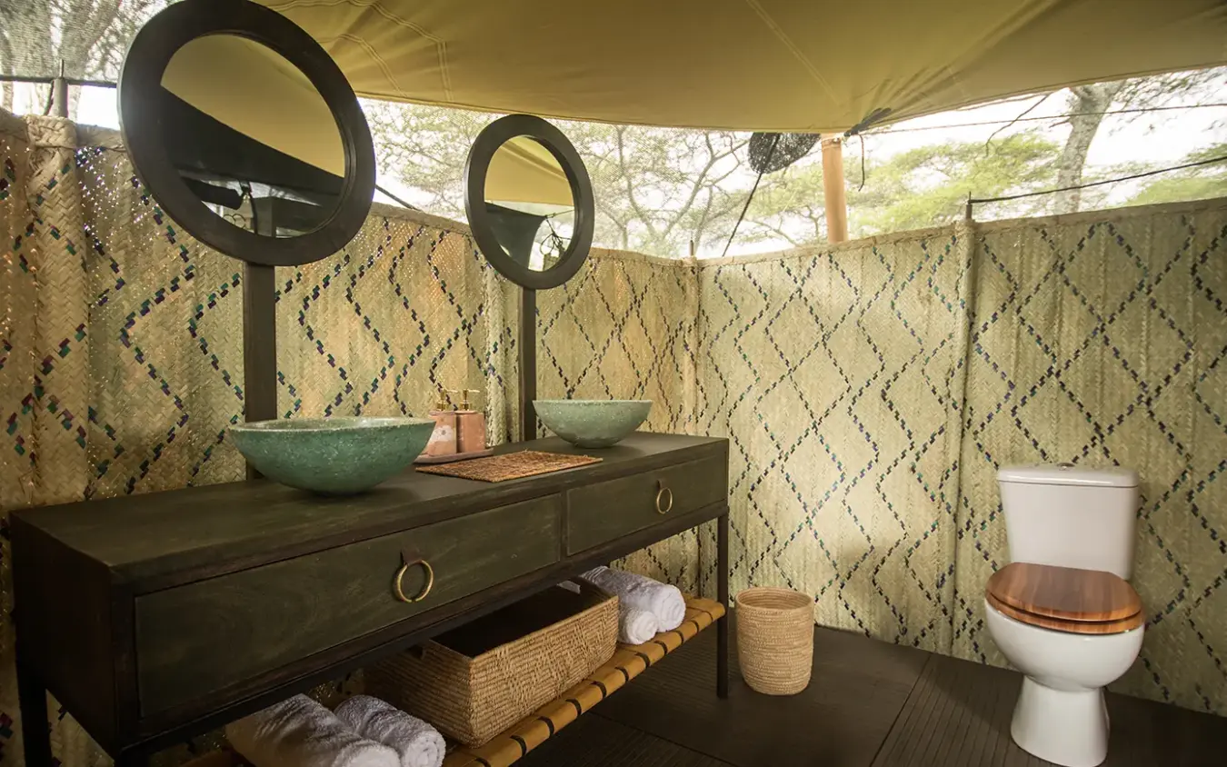 Outdoor bathroom with double vanity and toilet under canvas tent, Serengeti Green Camp, Serengeti National Park, Tanzania