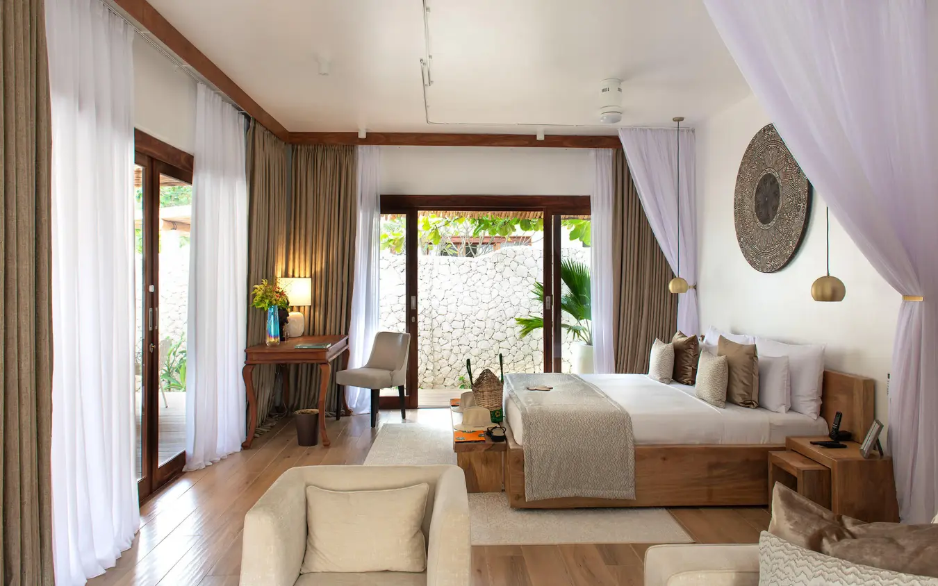 Spacious bedroom with wooden bed and garden views, White Sand Luxury Villas & Spa, Zanzibar & Pemba, Tanzania