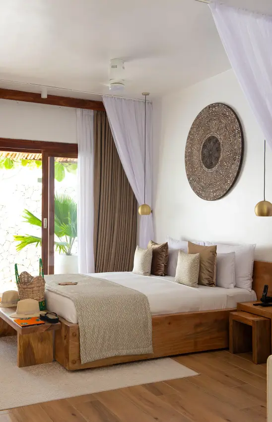 Luxury bedroom with wooden furnishings and tropical garden views, White Sand Luxury Villas & Spa, Zanzibar & Pemba, Tanzania