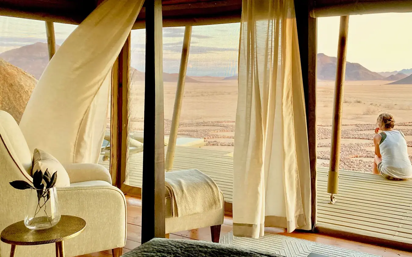 Modern bedroom with expansive desert views through floor-to-ceiling windows, Wolwedans Boulders Camp, NamibRand Private Reserve, Namibia