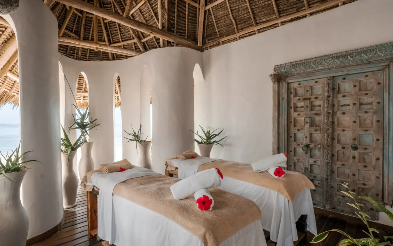 Spa treatment room with massage tables and flower petals, Xanadu Villas, Zanzibar & Pemba, Tanzania
